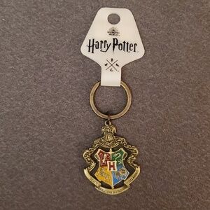 NWT Harry Potter metallic pivotal keychain. Four houses. From NYC store.